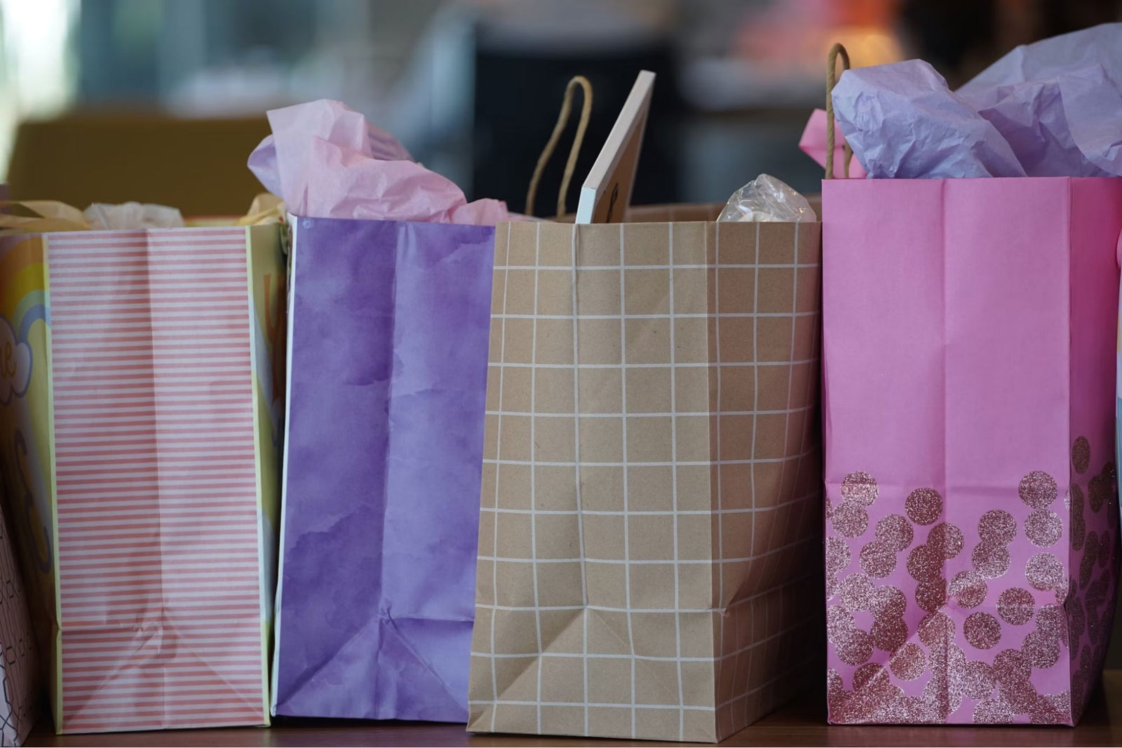 An image of four shopping bags, symbolizing the best padded bralette shopping experience.