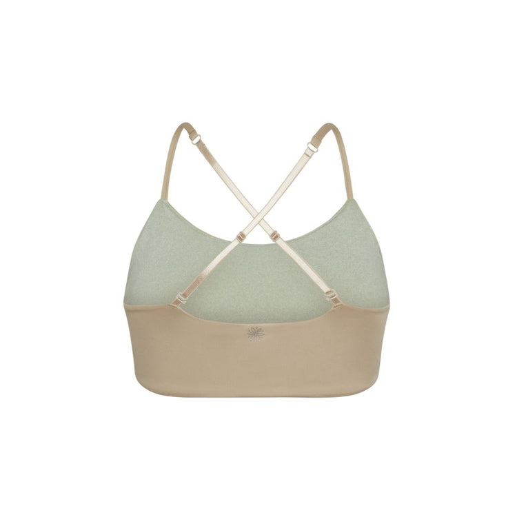 Close-up view of back of beige Bleum Active Bra with crisscross straps