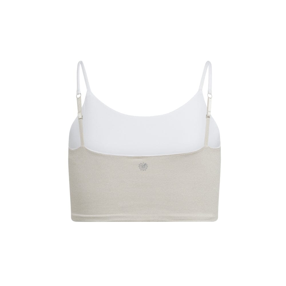 White-Dove#Back view of a beige crop top with white adjustable straps, displaying a small logo in the center.