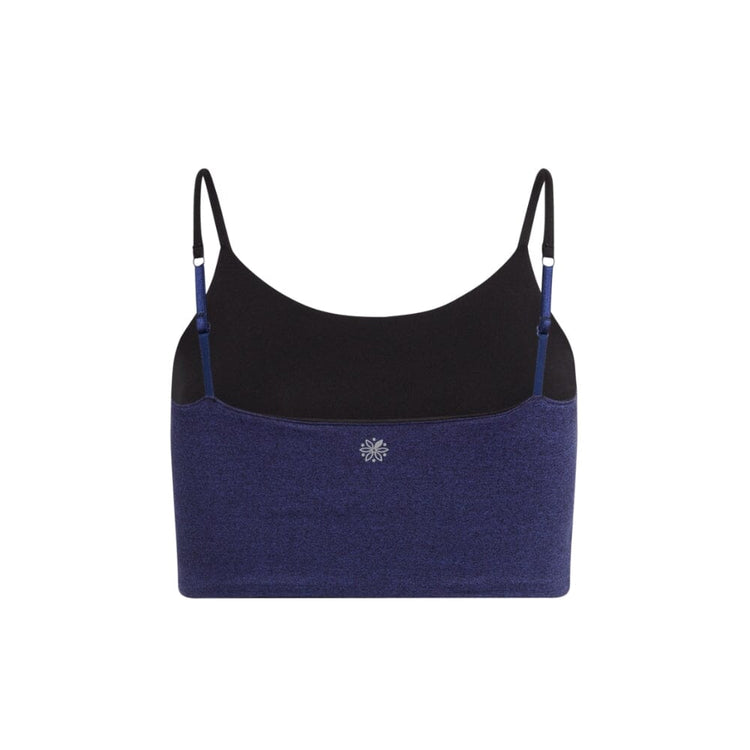 Back view of a violet crop top with black inner lining and black adjustable straps, featuring a small logo in the center.