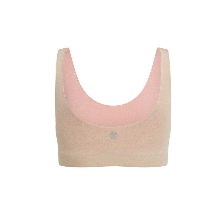 Back view of a beige aster organic tank bra with rose accents.