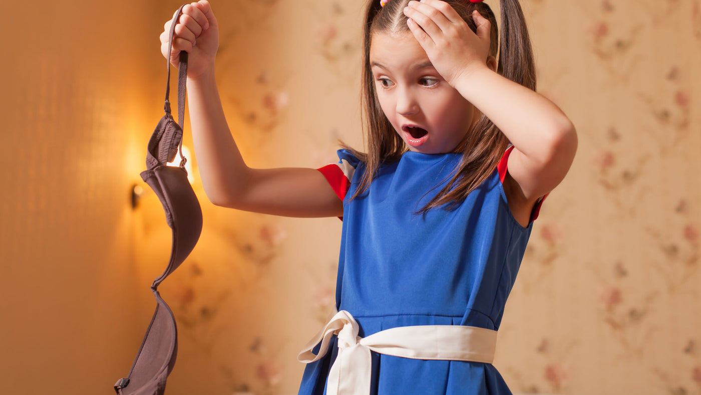 Young girl looking anxious about buying her first bra or training bra