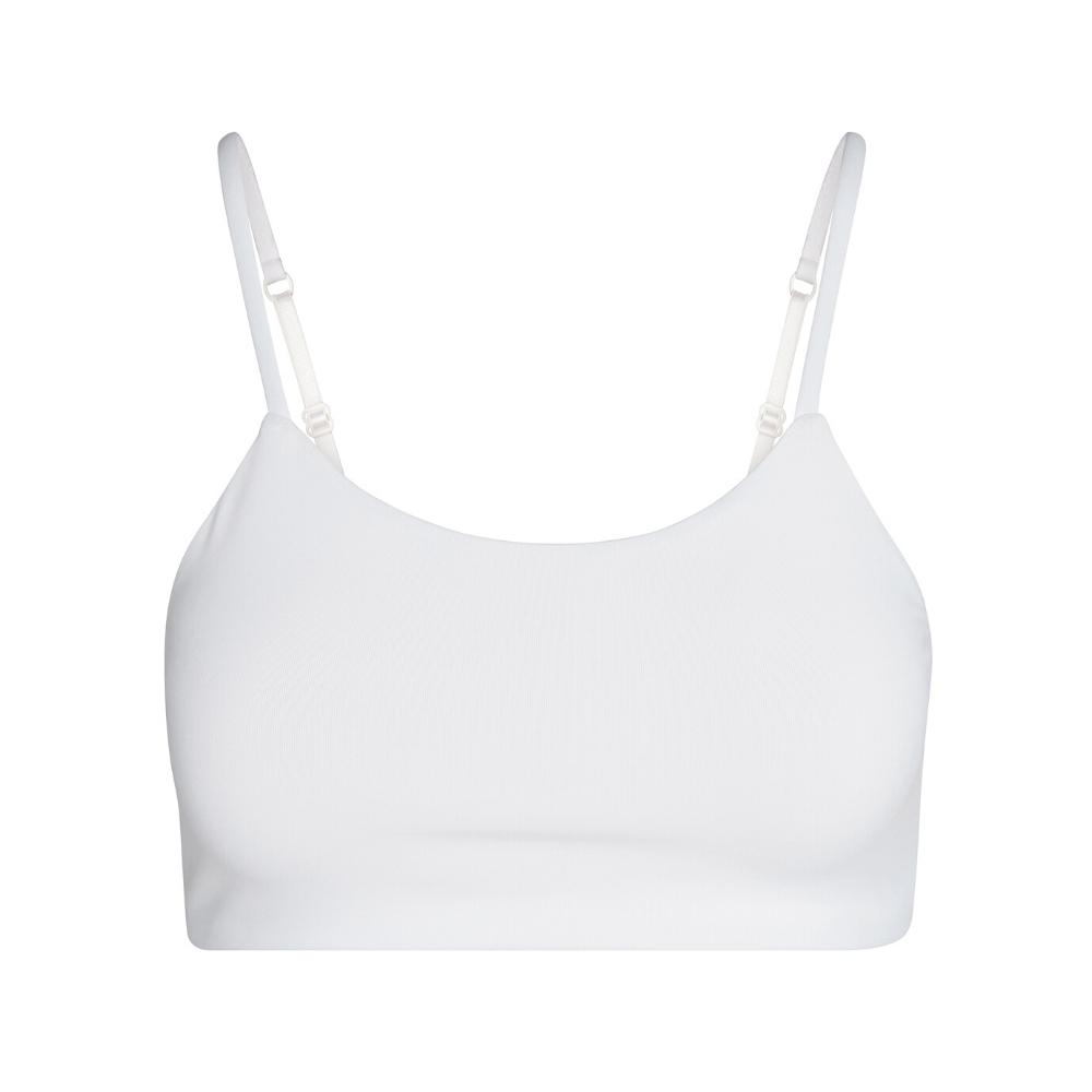 White#A white bra with adjustable straps, shown from the front.