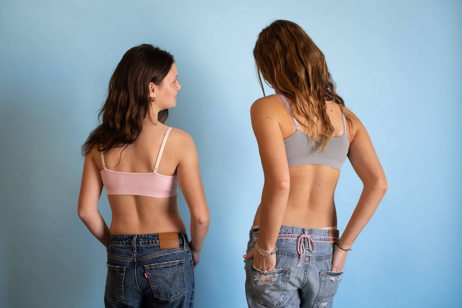 Two teenage girls wearing bras by Bleuet.