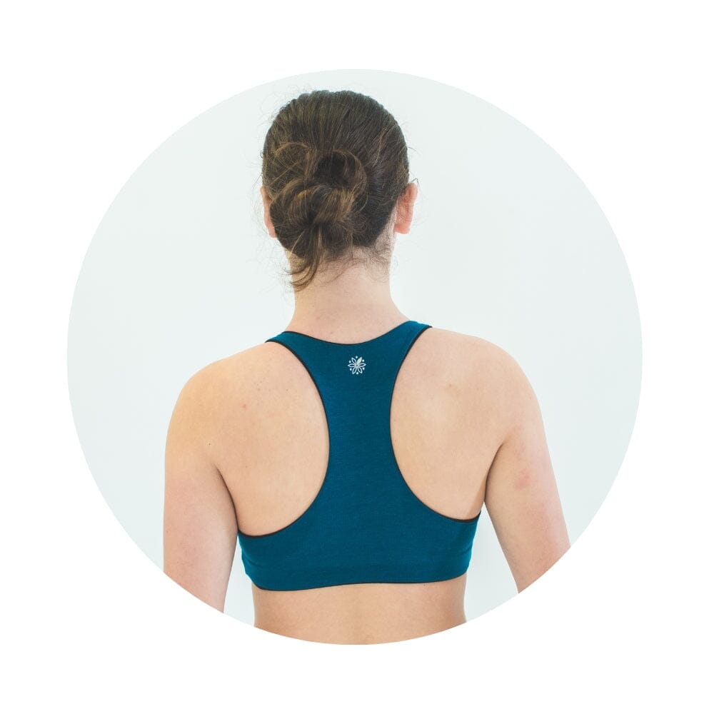 Black-Teal#A young woman from back wearing a teal racerback bra 