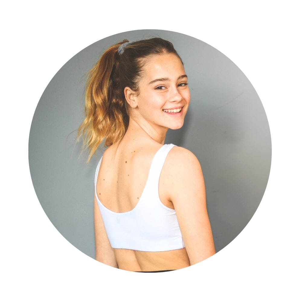 White-White#Front view of girl wearing white color aster organic tank bra.