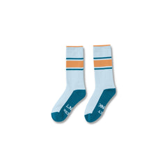 Light Blue#A pair of crew socks with a light blue body, teal toe and heel sections, and orange and dark teal stripes near the cuff. The word 'INK' is printed in white on the sole of one sock.