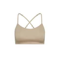 Sand-Sherbert#Close-up view beige Bleum Active Bra with crisscross straps