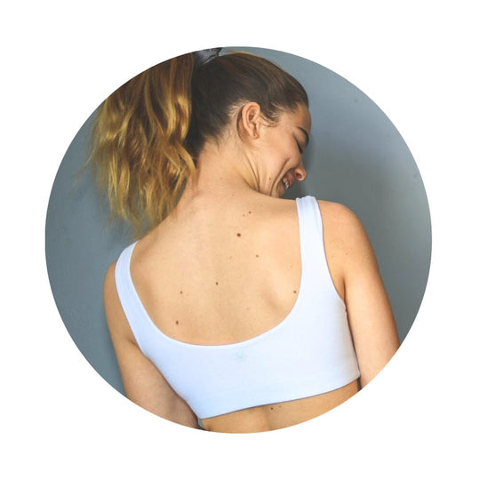 White-White#Back view of a girl wearing a white color aster organic tank bra.