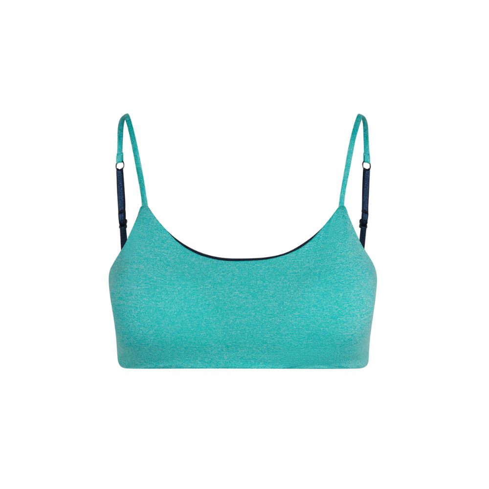 TA DA 🪄 Here is the NEW Bleum Petal Bra in Mint-Navy!! This bra is:  🦚Super soft 🦚Seamless & itch-free 🦚Reversible 🦚Pads se