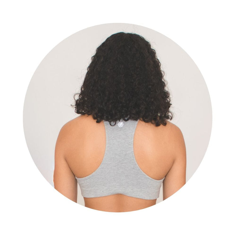 Grey-Lake#Back view of a woman with curly hair wearing a gray racerback bra.