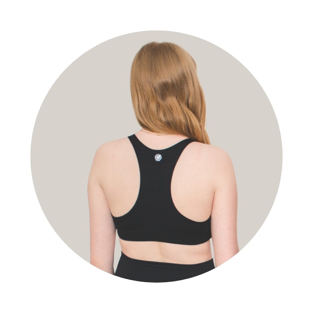 Black-Teal#Back view of a young woman with long blonde hair wearing a black racerback bra.