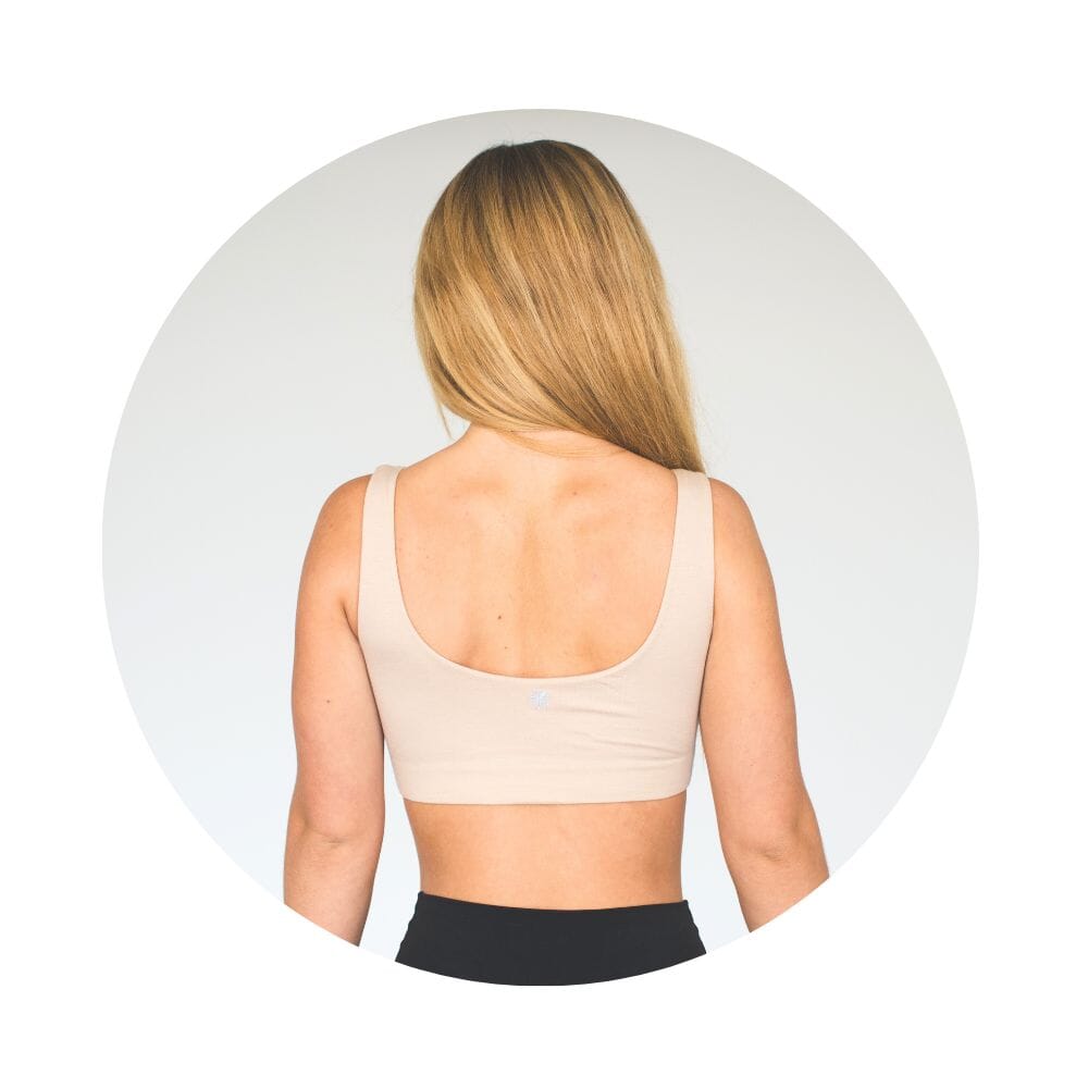Aster Bra Bundle#Woman with long blonde hair wearing a sand-colored tank bra, back view.
