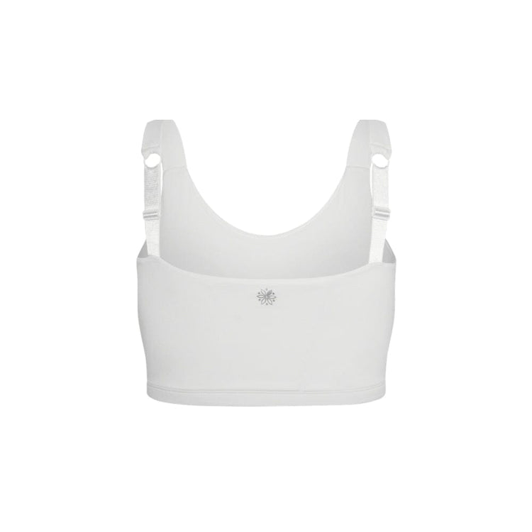 A white sports bra with adjustable shoulder straps and a small silver geometric logo on the center chest, shown against a plain white background.