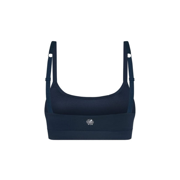 Navy teen sports bra with thin straps on a white background