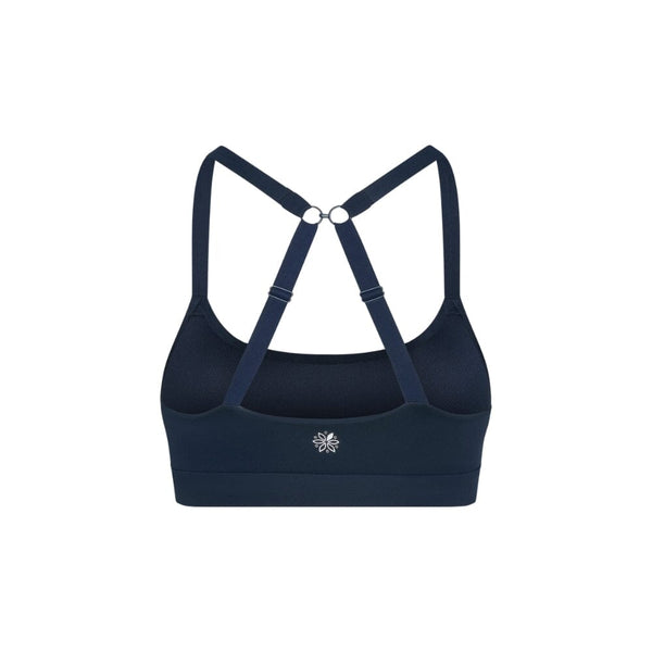 Navy teen sports bra with thin x-back straps on a white background from back