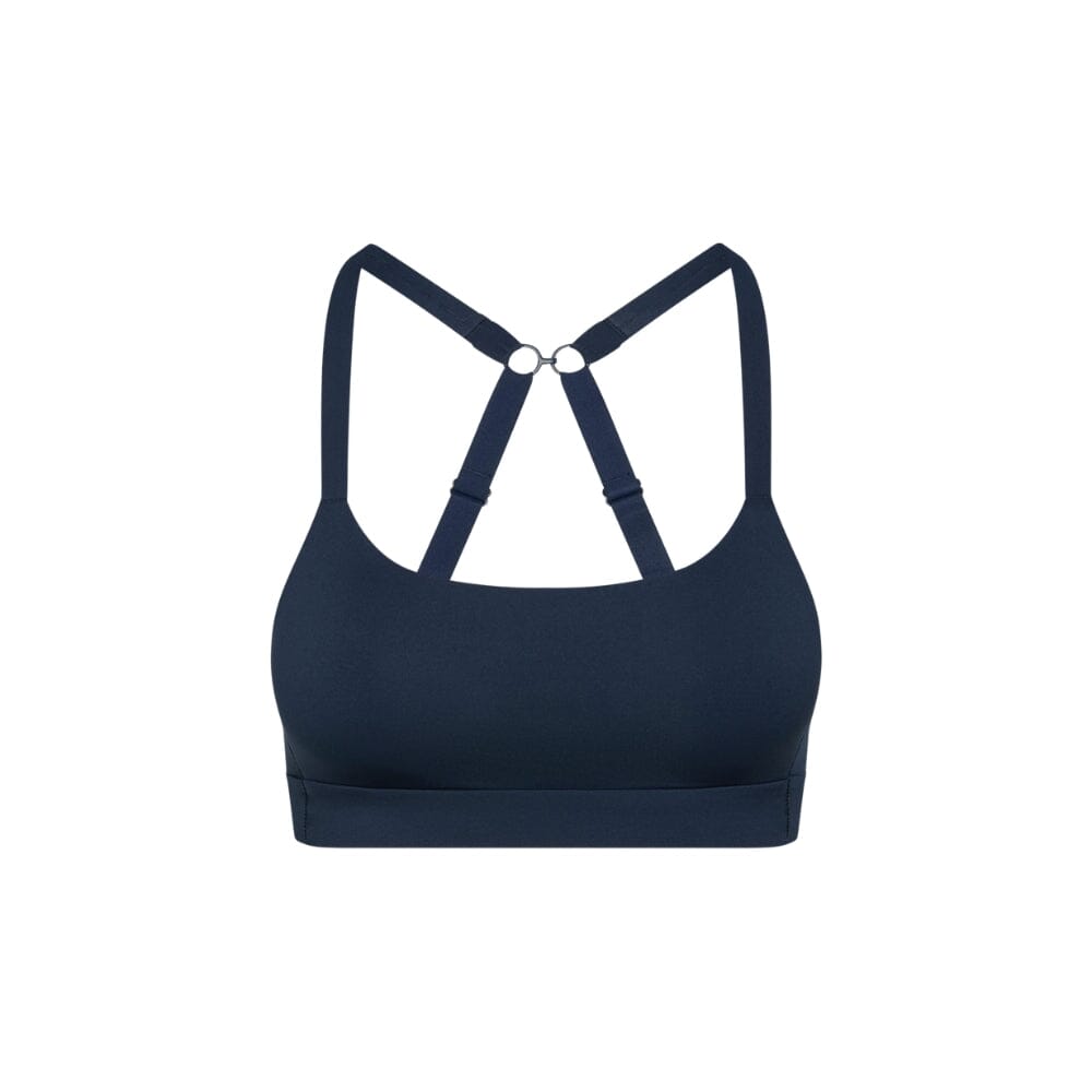Navy#Navy teen sports bra with thin x-back straps on a white background from front
