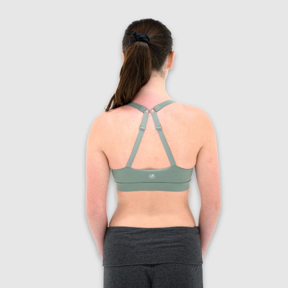 Sage#Girl in best teen sports bra in sage green from back with x-back