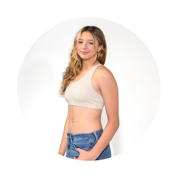 Sand-Mist#A young girl with long blonde hair, wearing a beige racerback bra