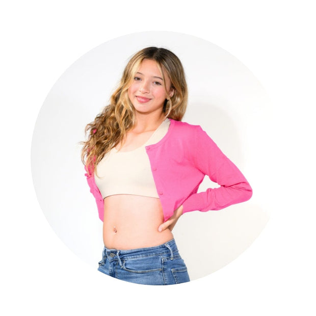 Sand-Mist#A young girl with long blonde hair, wearing a beige racerback bra
