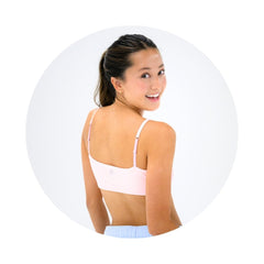 Light Pink#Girl wear best organic cotton girls bra in light pink looking over shoulder