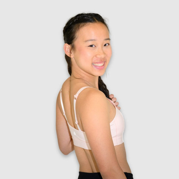Ballet Pink#Girl Light Pink girls sport bra looking over shoulder