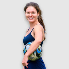 Navy#Girl in Navy teen sports bra on a pink background