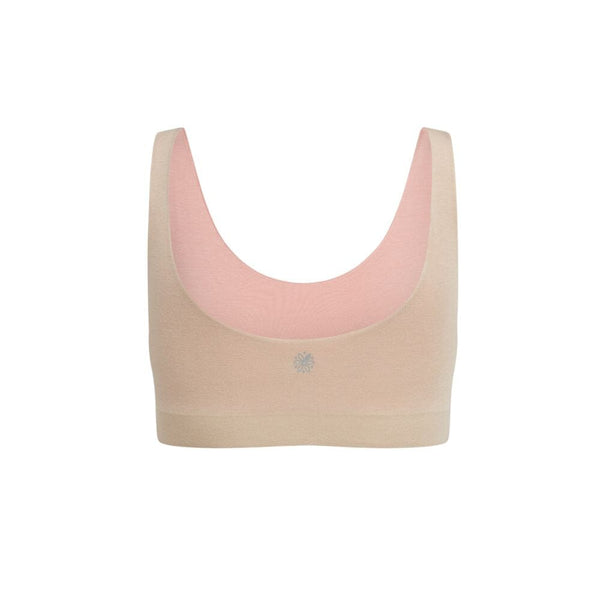 Back view of a beige aster organic tank bra with rose accents.