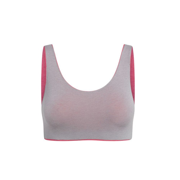 Front view of a gray aster organic tank bra with pink accents.