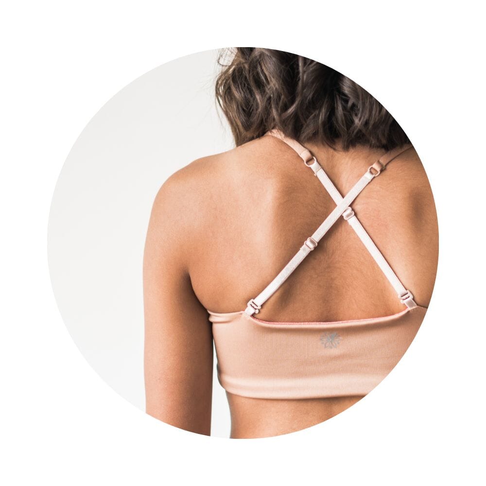 Caramel-Persimmon#Close-up of the back view of a model wearing a caramel-colored Bleum Active Bra by Bleuet-girl, highlighting the crisscross straps. Caramel-Persimmon#Sports Bras & Bralettes For Girls, Tweens and Teens