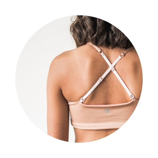 Caramel-Persimmon#Close-up of the back view of a model wearing a caramel-colored Bleum Active Bra by Bleuet-girl, highlighting the crisscross straps. Caramel-Persimmon#Sports Bras & Bralettes For Girls, Tweens and Teens