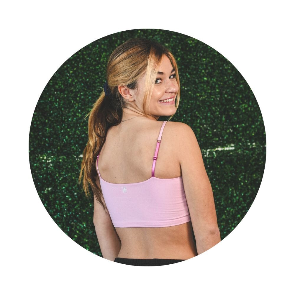 Pink-Magenta#A girl with blonde hair wearing a pink cami bra, viewed from the back.