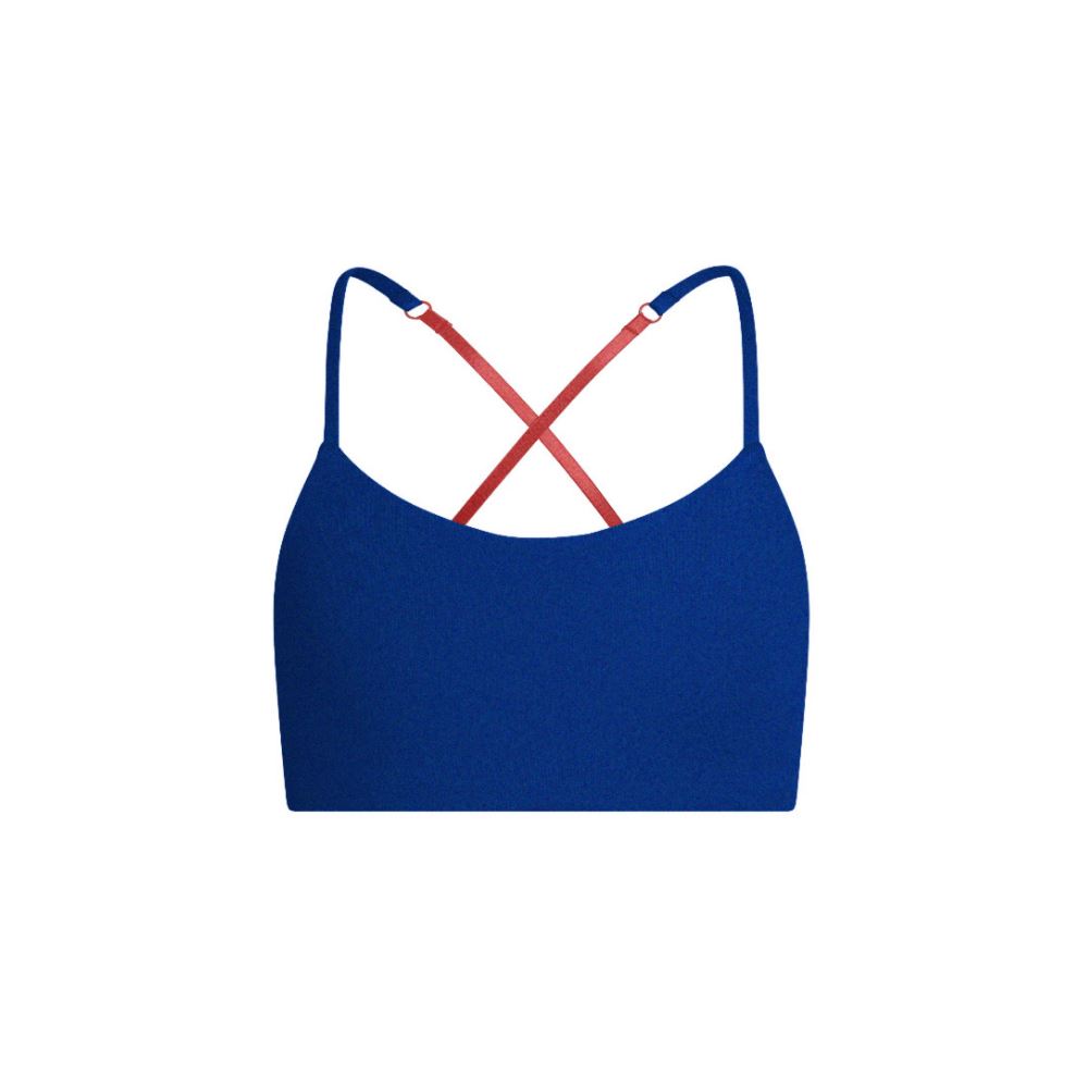 Blue-Persimmon#A blue Bleum Active Bra by Bleuet-girl shown from the front, with red straps. Blue-Persimmon#Sports Bras & Bralettes For Girls, Tweens and Teens