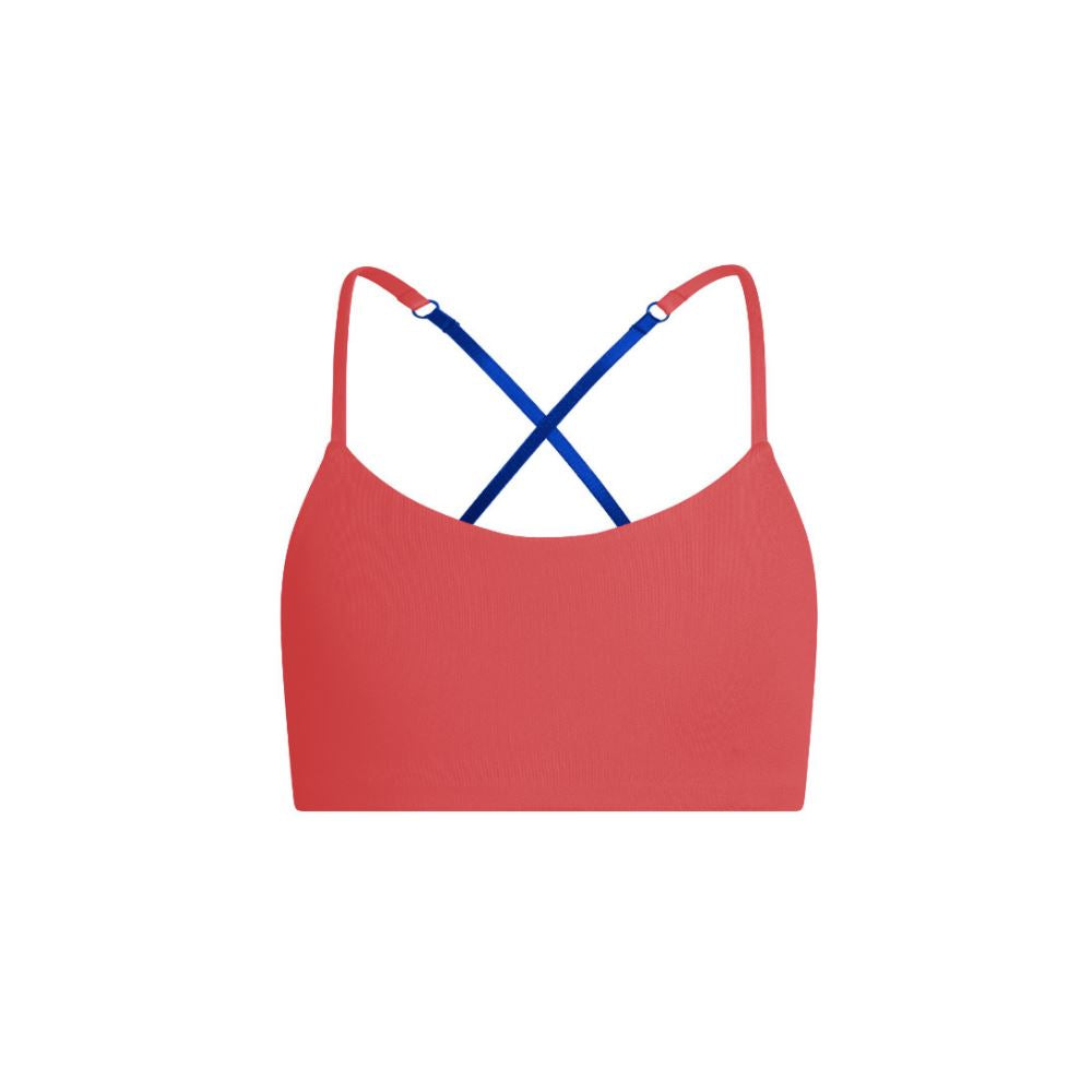 Blue-Persimmon#A red Bleum Active Bra by Bleuet-girl shown from the front, with blue straps.